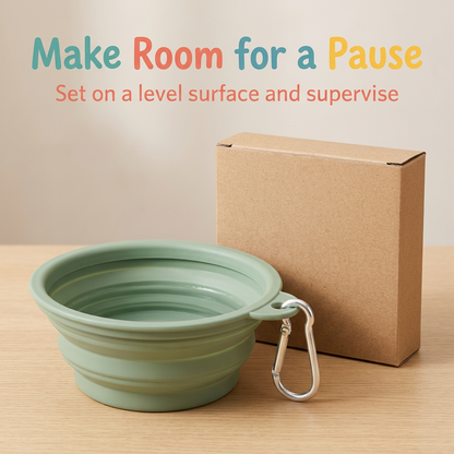 Expanded sage green pet bowl with water on a level surface